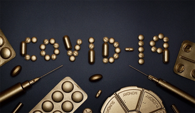 covid scritta oro siringhe